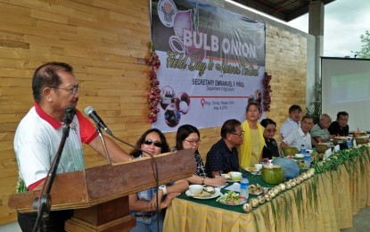 <p><strong>DA CHIEF IN ILOILO.</strong> Agriculture Secretary Emmanuel Piñol speaks during the Bulb Onion Field Day and Harvest Festival held in Barangay Durog in Miag-ao, Iloilo City on Friday (May 4, 2018).  <em>(Photo by Perla Lena) </em></p>